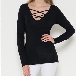 Brand new Long Sleeve Black Criss Criss Top